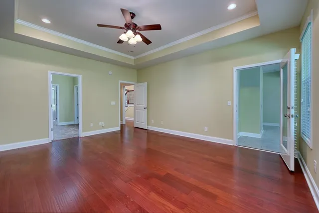 a spacious bathroom with a granite countertop sink and a mirror