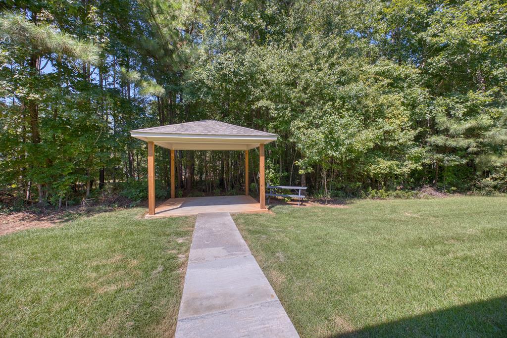 182 Oak Ridge Drive Waverly Hall, GA 31831 - Photo 7 of 40 a view of a table and chairs in backyard of the house