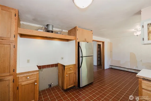 a view of a storage & utility room with empty racks