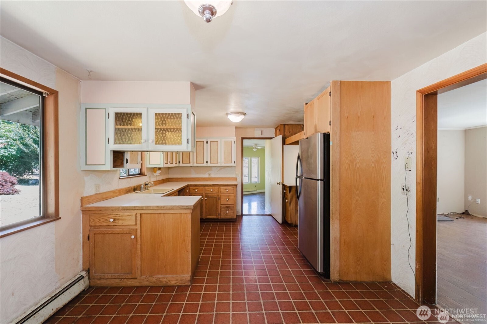 1783 West Shelton Matlock Road Shelton, WA 98584 - Photo 9 of 40 a view of a kitchen with a sink and a refrigerator