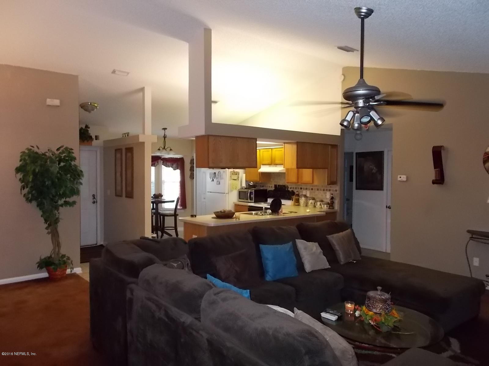 8684 Springtree Road Jacksonville, FL 32210 - Photo 11 of 26 Living Area to Kitchen