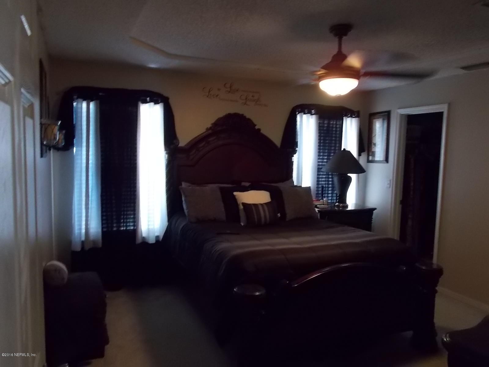 8684 Springtree Road Jacksonville, FL 32210 - Photo 19 of 26 Master Bedroom