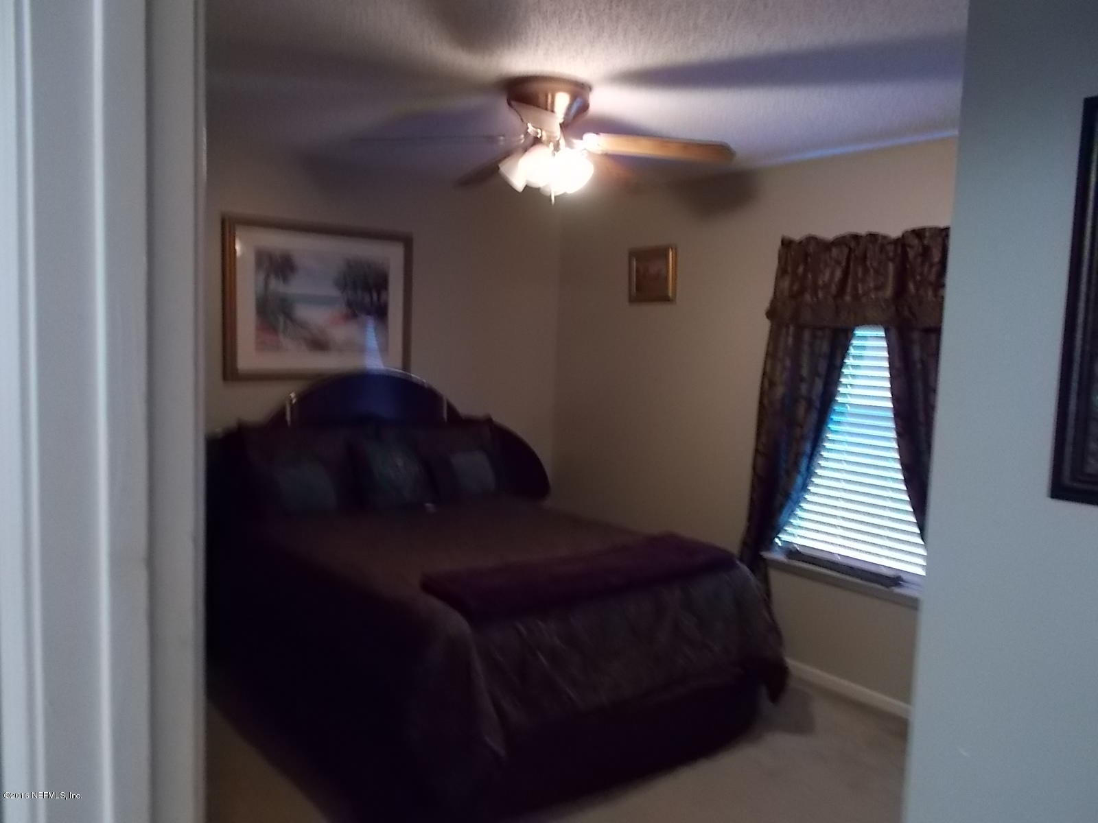 8684 Springtree Road Jacksonville, FL 32210 - Photo 22 of 26 Bedroom 2