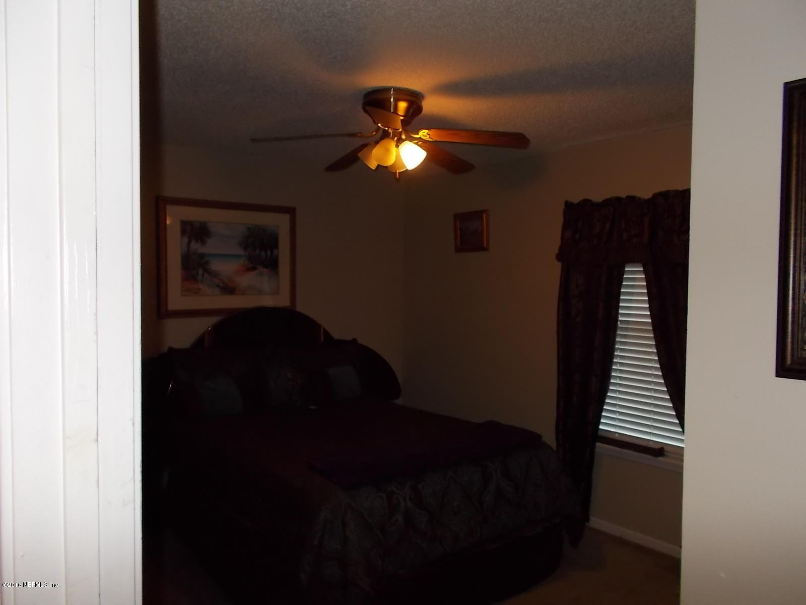 8684 Springtree Road Jacksonville, FL 32210 - Photo 24 of 26 Bedroom 3