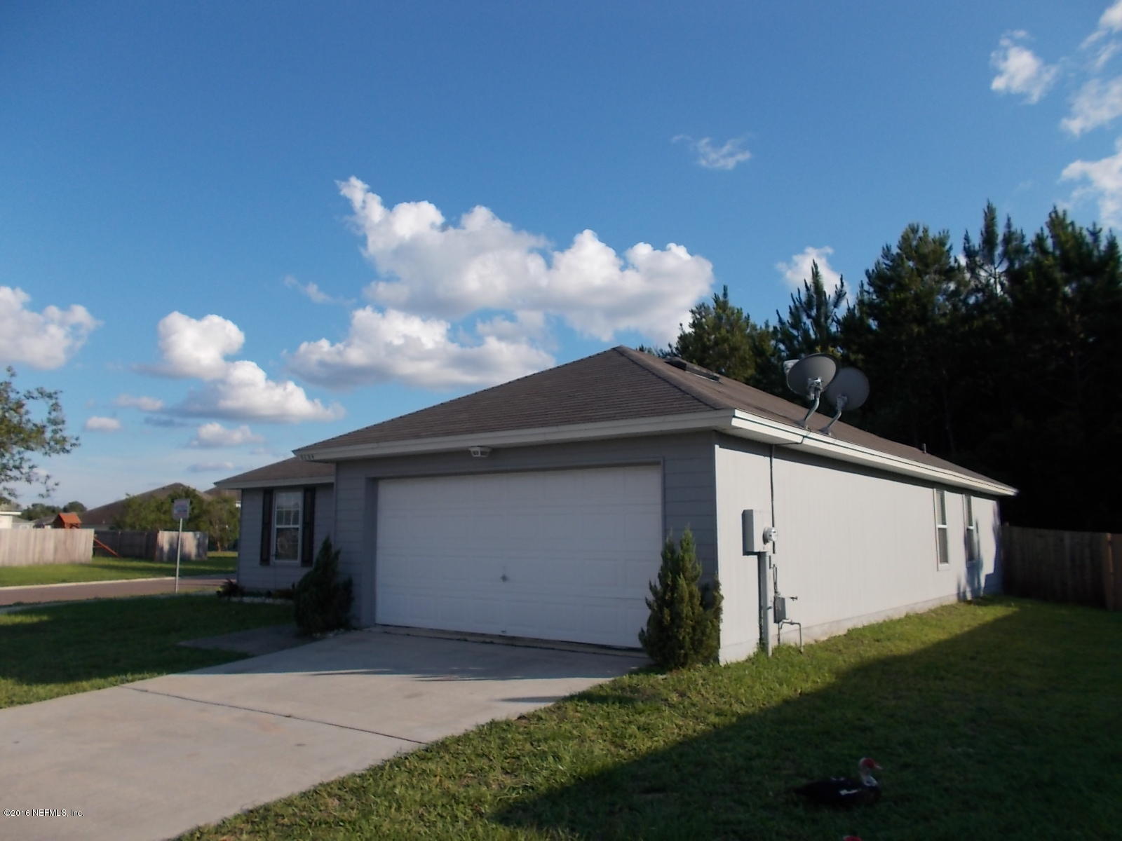 8684 Springtree Road Jacksonville, FL 32210 - Photo 4 of 26 2 car garage