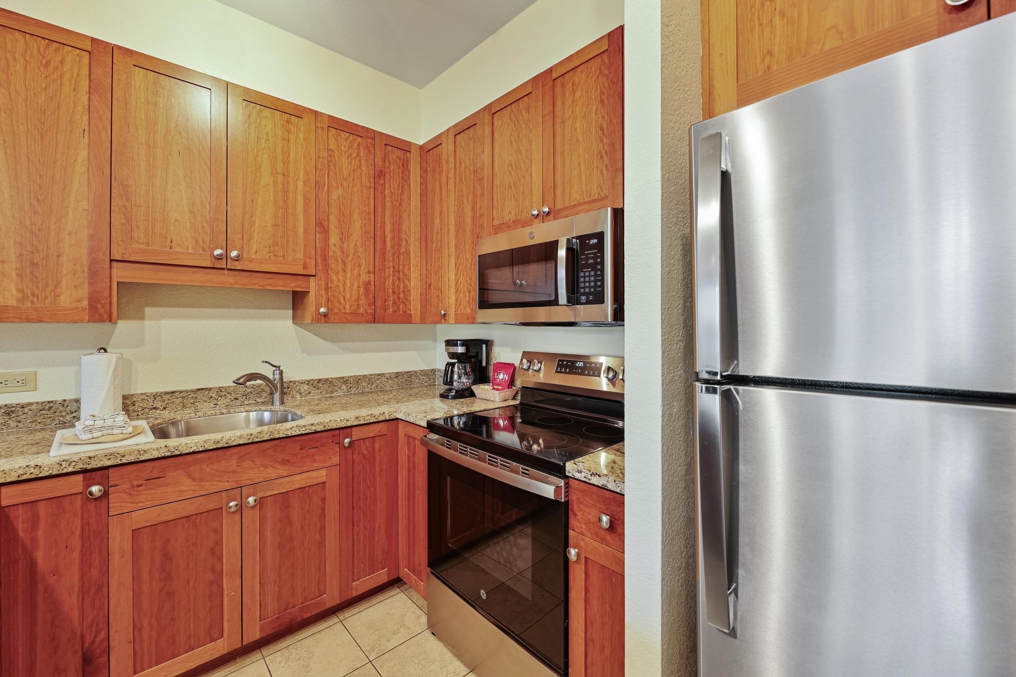 3445 Lower Honoapiilani Road, Unit 151 Lahaina, HI 96761 - Photo 12 of 42 a kitchen with a refrigerator sink and microwave