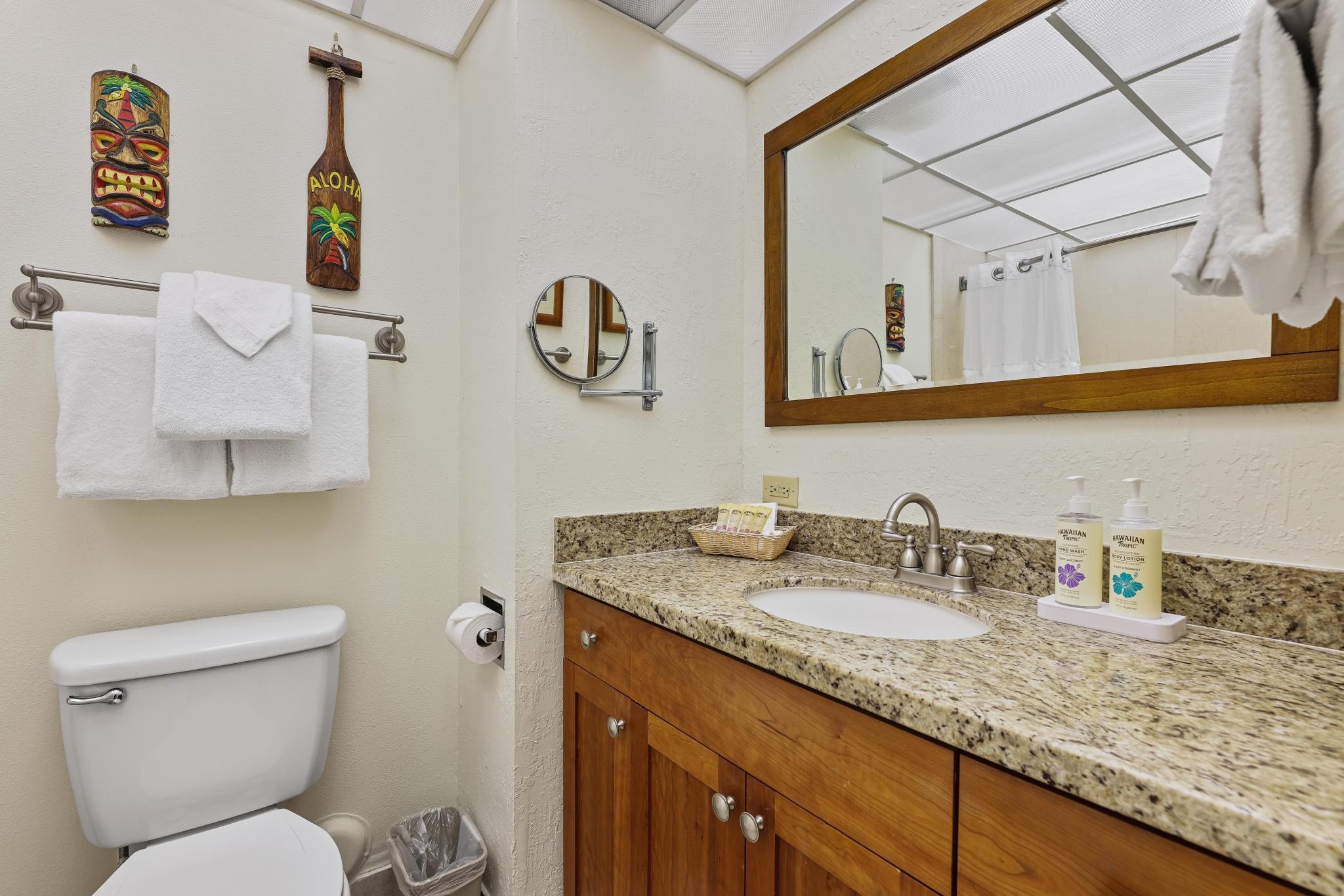 3445 Lower Honoapiilani Road, Unit 151 Lahaina, HI 96761 - Photo 15 of 42 a bathroom with a granite countertop sink mirror vanity and toilet