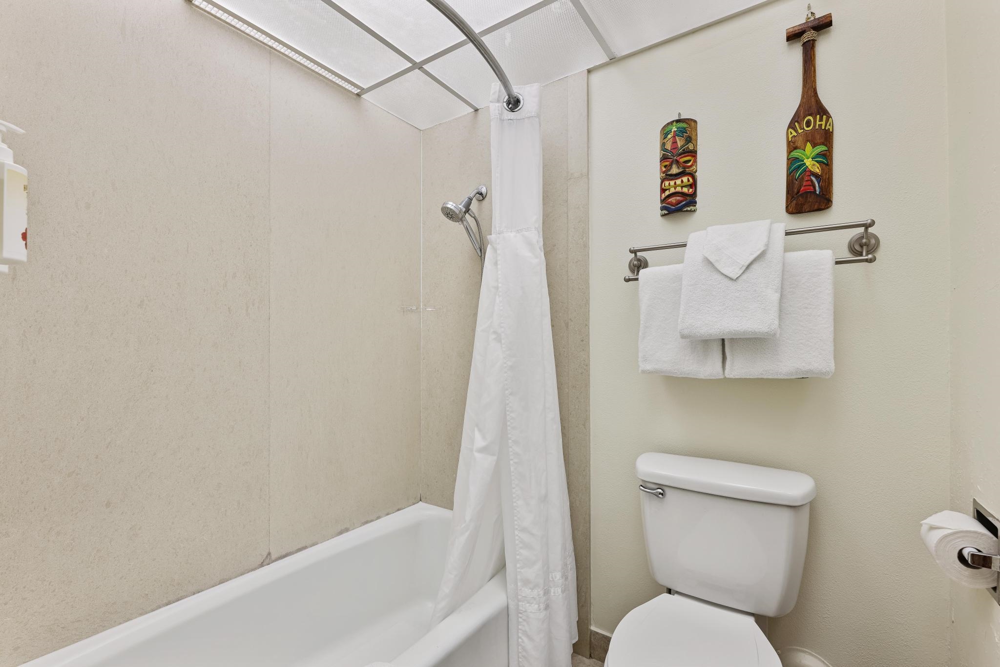 3445 Lower Honoapiilani Road, Unit 151 Lahaina, HI 96761 - Photo 16 of 42 a white toilet sitting next to a bathroom sink