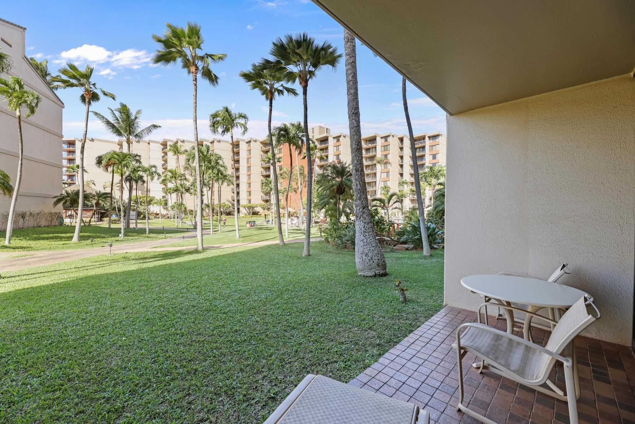 3445 Lower Honoapiilani Road, Unit 151 Lahaina, HI 96761 - Photo 2 of 42 a view of yard with swimming pool outdoor seating and green space
