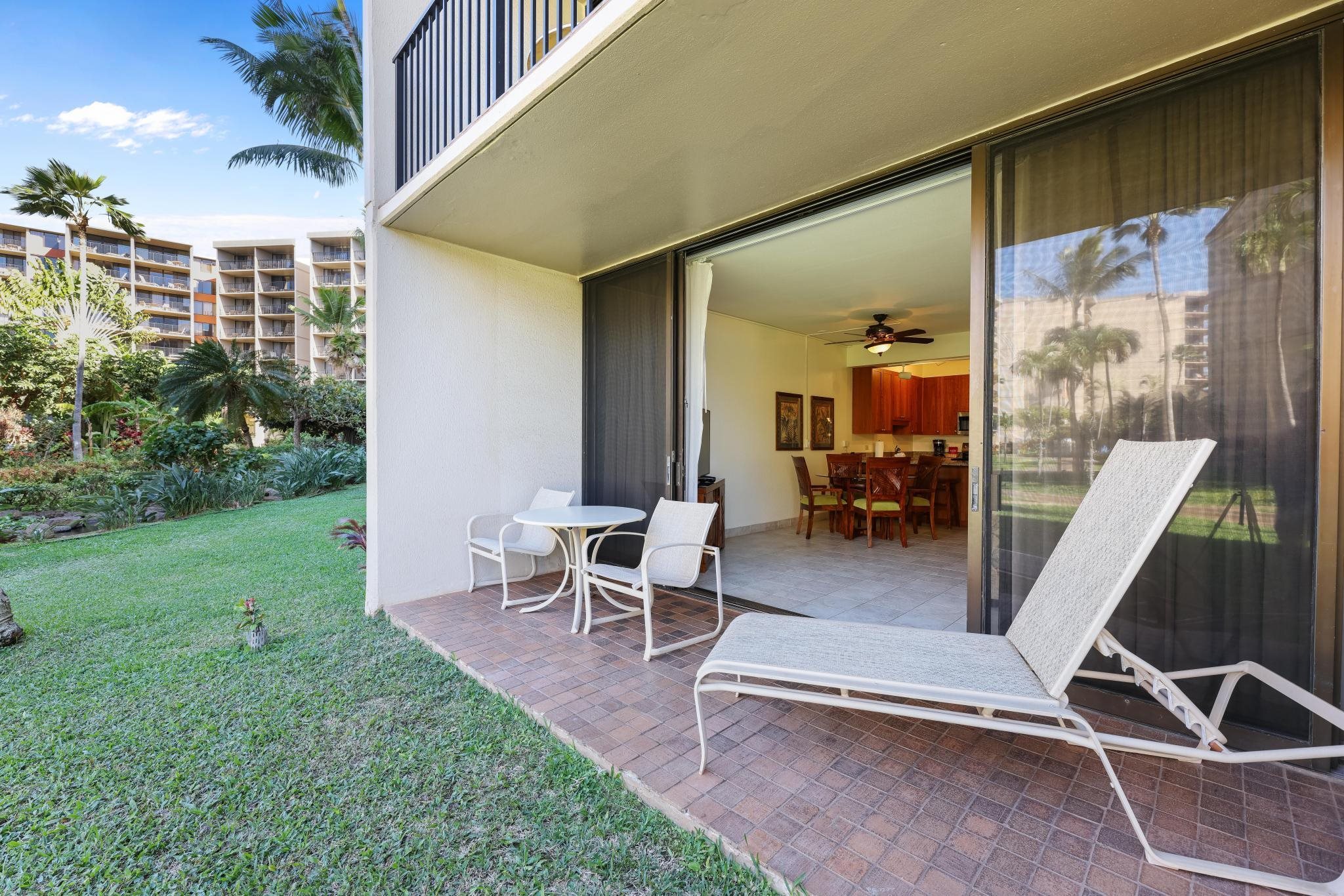 3445 Lower Honoapiilani Road, Unit 151 Lahaina, HI 96761 - Photo 21 of 42 a view of a patio with table and chairs and potted plants