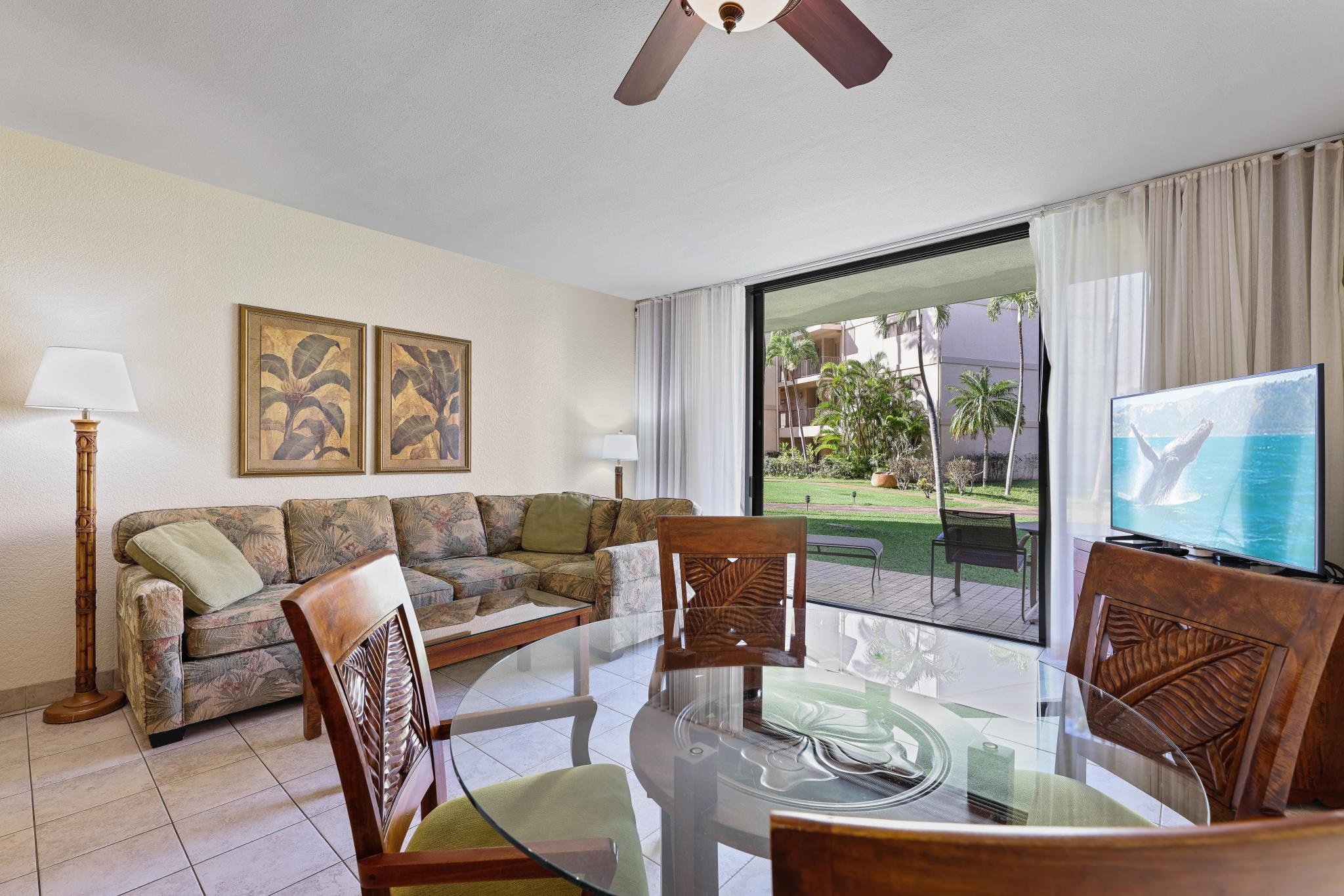 3445 Lower Honoapiilani Road, Unit 151 Lahaina, HI 96761 - Photo 5 of 42 a living room with furniture and a large window