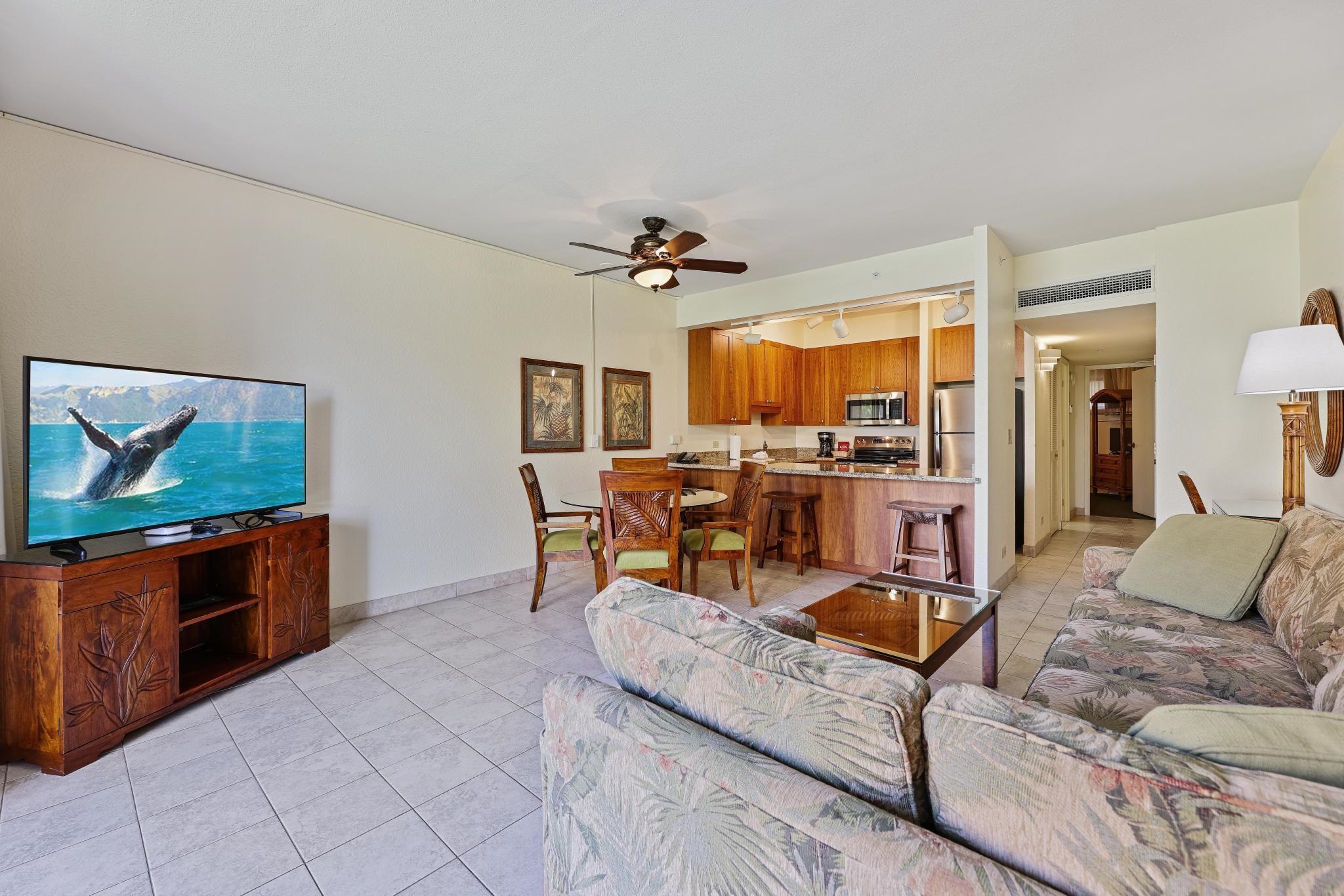 3445 Lower Honoapiilani Road, Unit 151 Lahaina, HI 96761 - Photo 6 of 42 a living room with furniture kitchen view and a chandelier