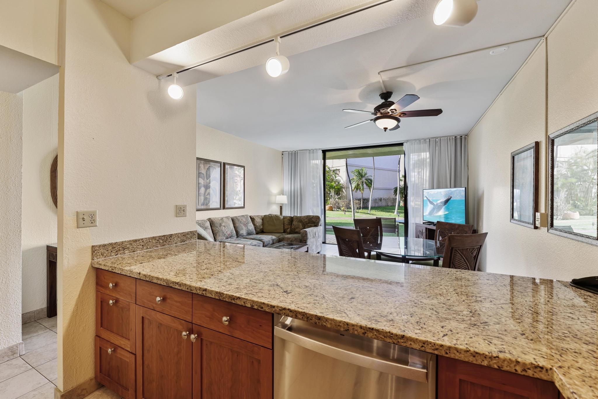 3445 Lower Honoapiilani Road, Unit 151 Lahaina, HI 96761 - Photo 9 of 42 a view of living room with granite countertop furniture and fireplace