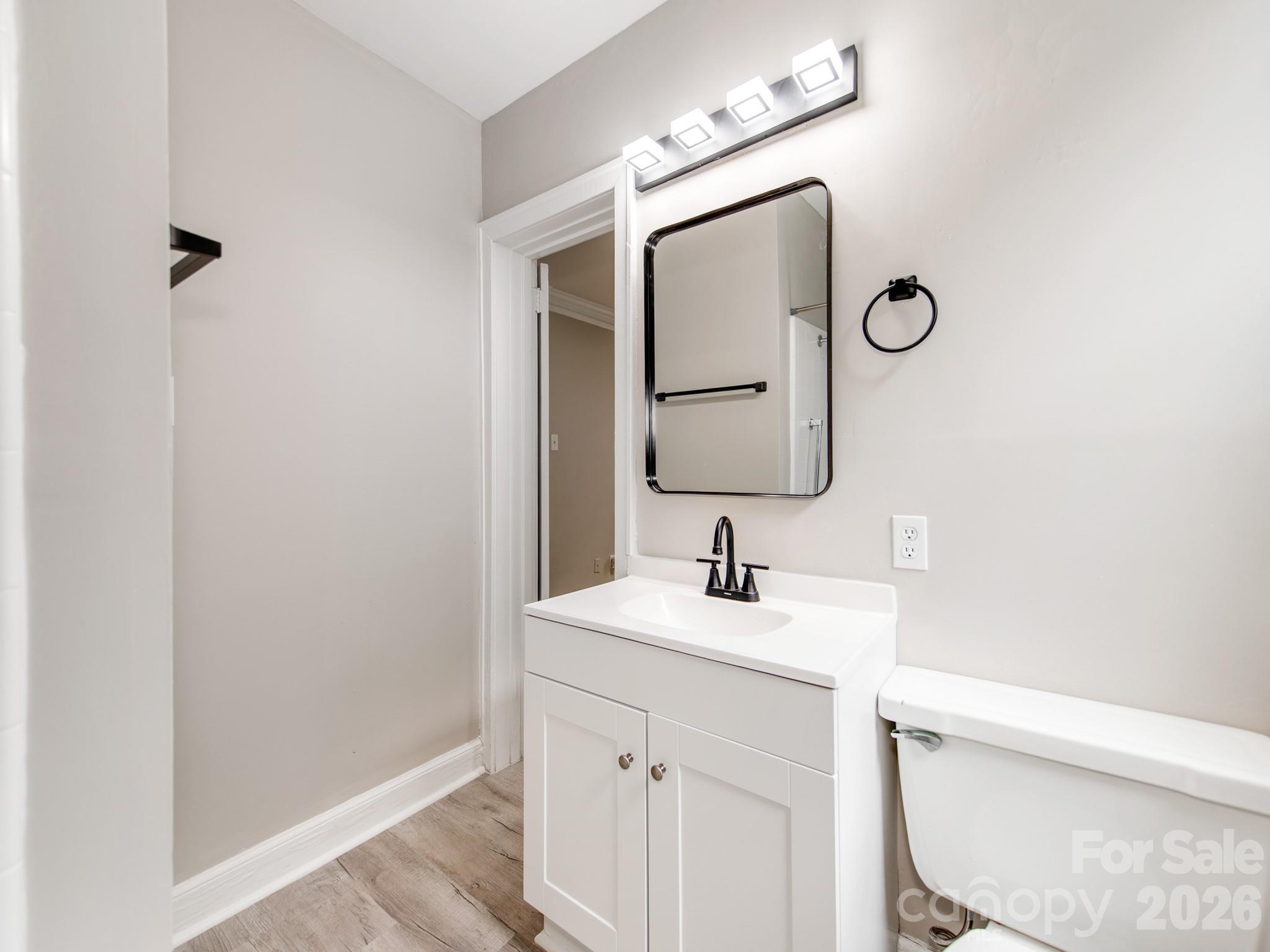 4699 Cherrystone Road Lancaster, SC 29720 - Photo 18 of 28 a bathroom with a sink vanity granite and a mirror