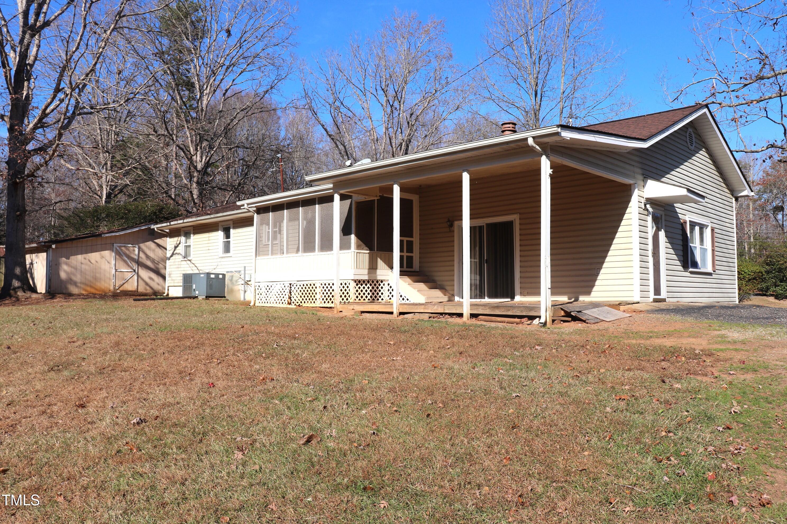 1109 Stoney Mountain Road Rougemont, NC 27572 - Photo 4 of 4 a house with white door of garage