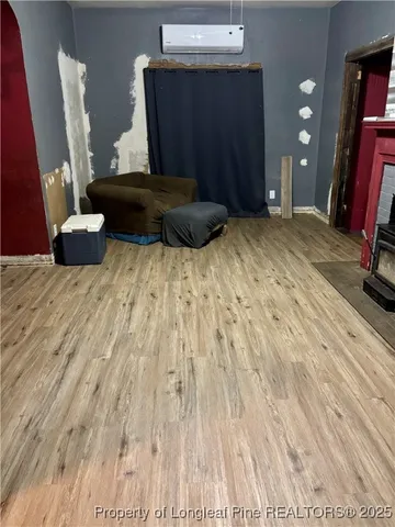 a bedroom with a bed and a mirror