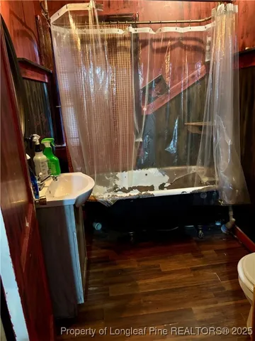 a front view of a house with wooden fence