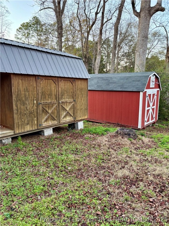 205 North College Street Red Springs, NC 28377 - Photo 10 of 10 a view of backyard with tub and wooden fence