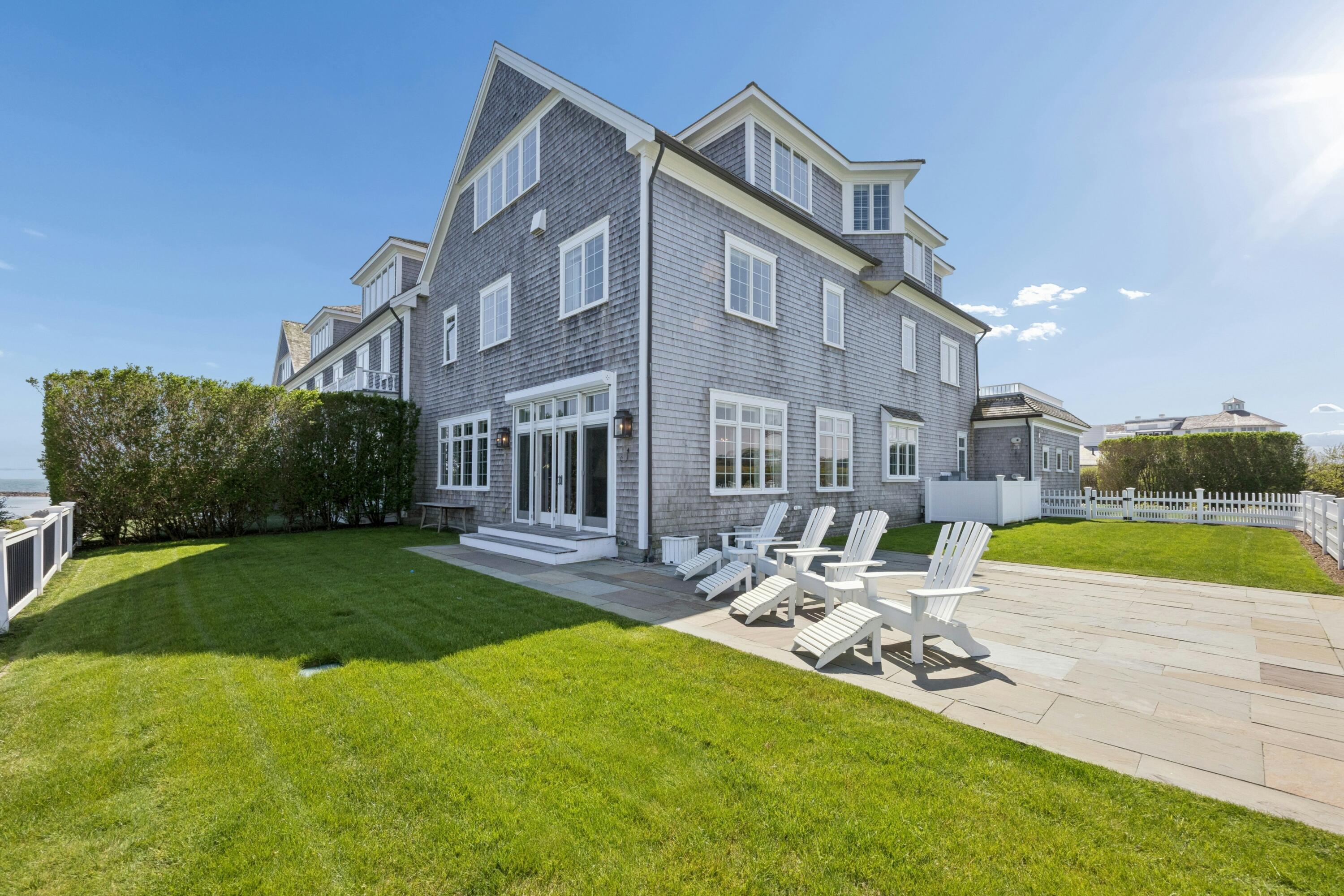 23 Snow Inn Road, Unit 7 Harwich Port, MA 02646 - Photo 7 of 37 a view of a building with a yard