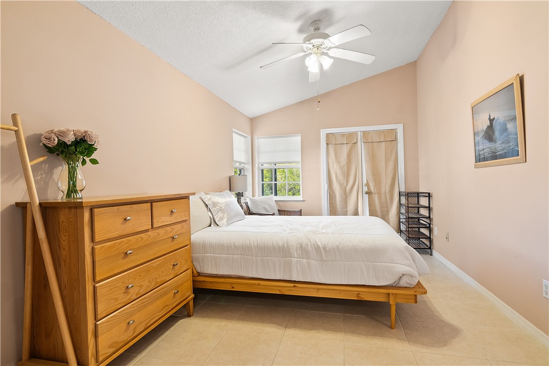 922 Jackson Way Fort Pierce, FL 34949 - Photo 22 of 34 a bedroom with a bed dresser and a window