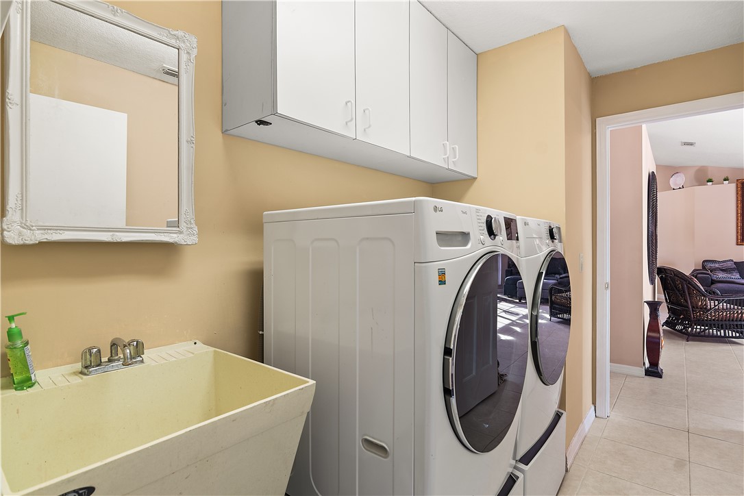 922 Jackson Way Fort Pierce, FL 34949 - Photo 24 of 34 a utility room with dryer and washer
