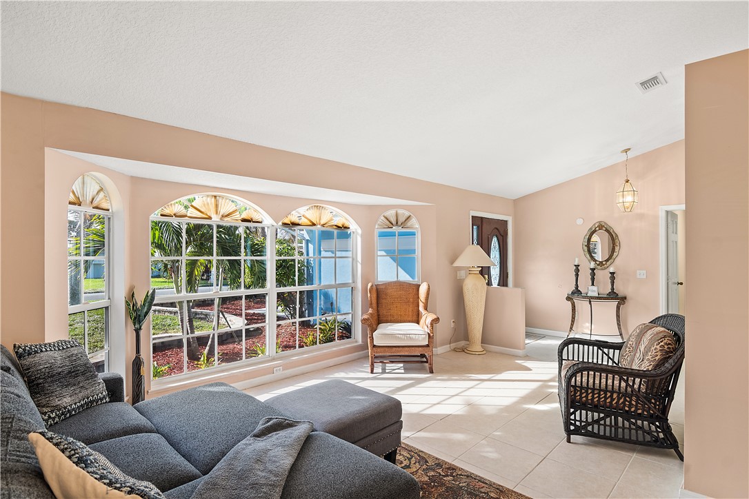 922 Jackson Way Fort Pierce, FL 34949 - Photo 9 of 34 a living room with furniture and a large window