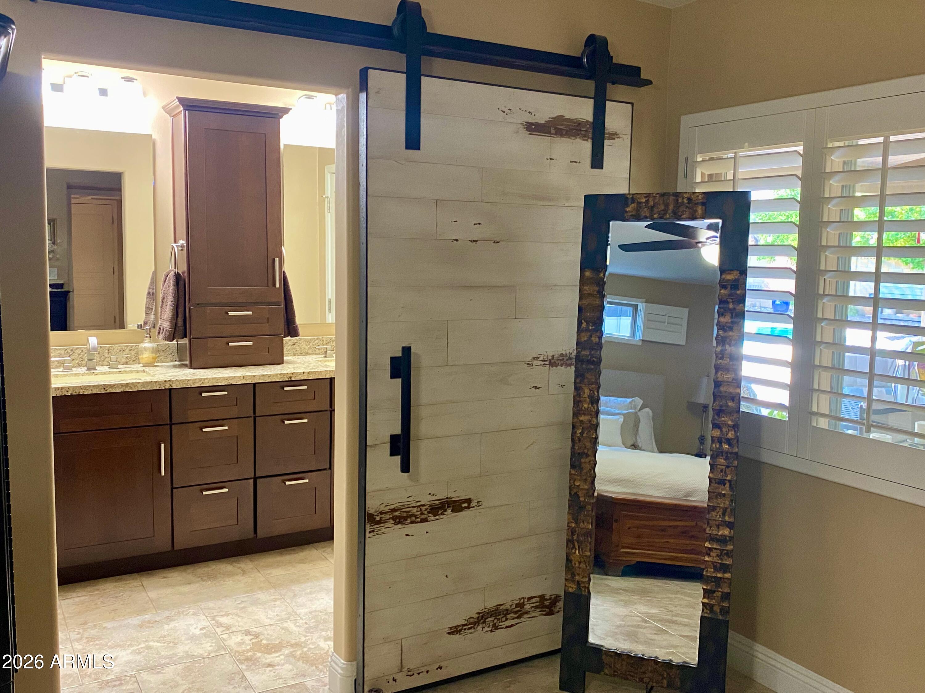 5610 East Justine Road Scottsdale, AZ 85254 - Photo 12 of 28 a bathroom with a sink and a mirror