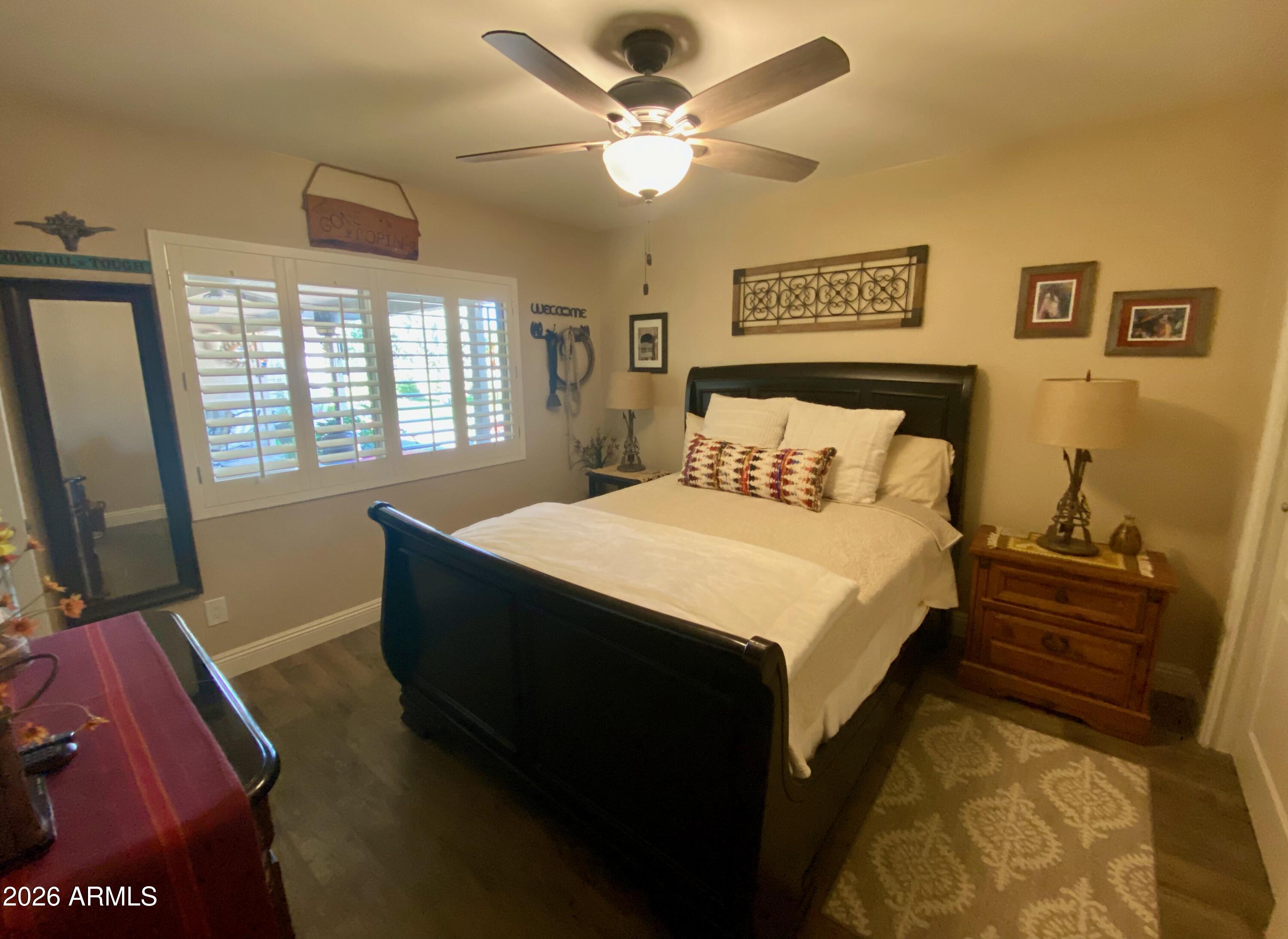 5610 East Justine Road Scottsdale, AZ 85254 - Photo 15 of 28 a bed sitting in a bedroom next to a window