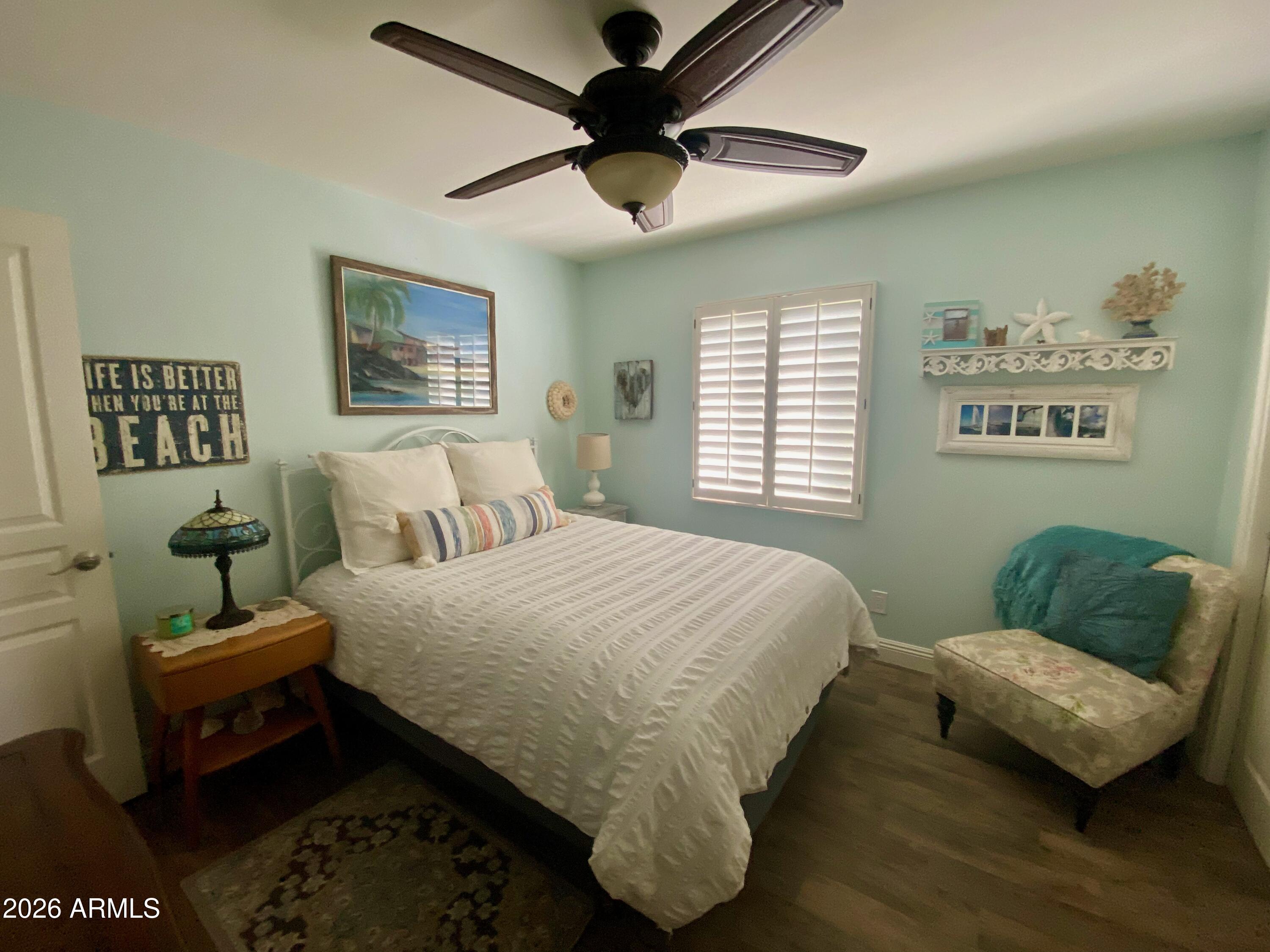 5610 East Justine Road Scottsdale, AZ 85254 - Photo 16 of 28 a bedroom with bed and a couch