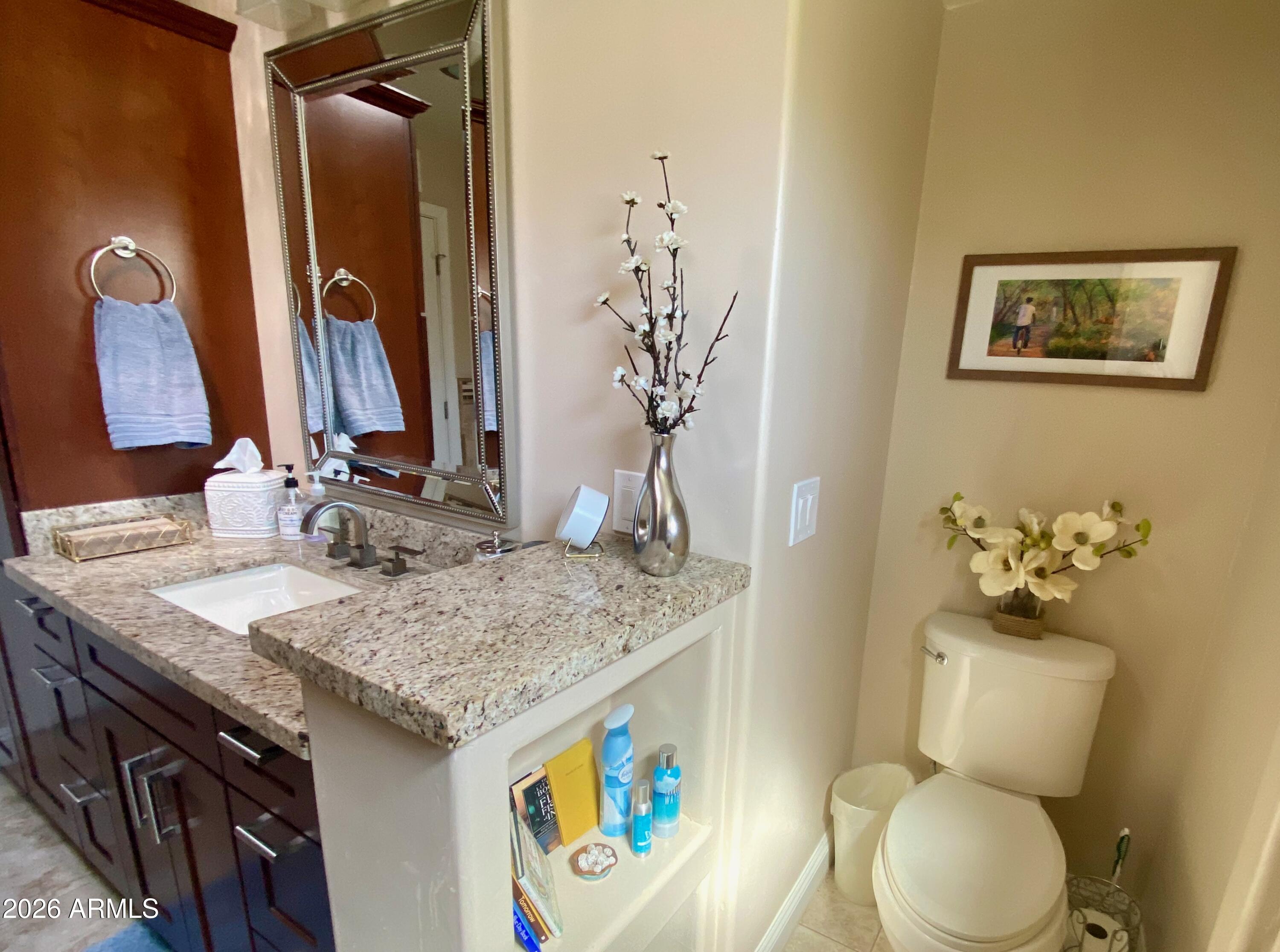 5610 East Justine Road Scottsdale, AZ 85254 - Photo 18 of 28 a bathroom with a granite countertop sink and a mirror