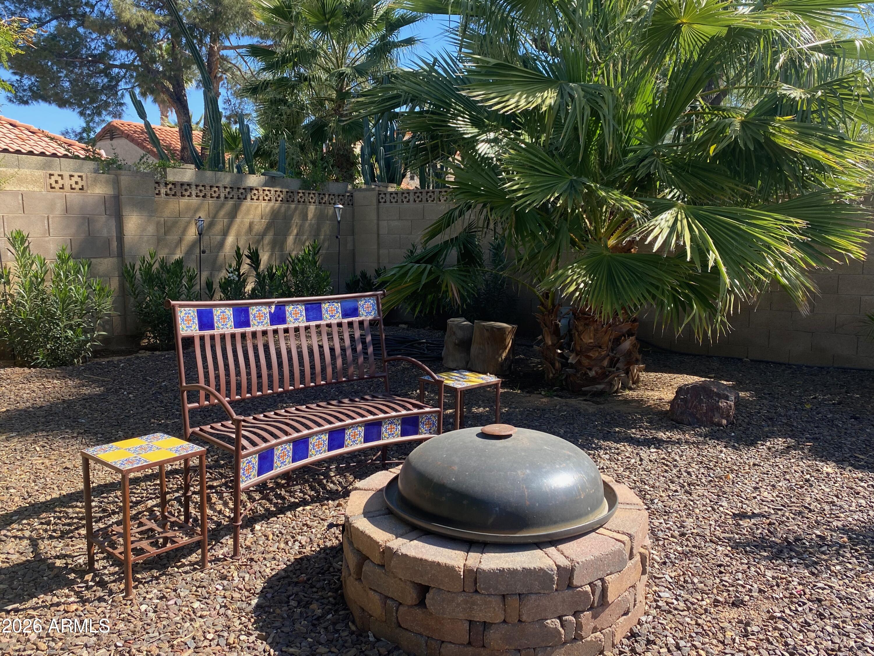 5610 East Justine Road Scottsdale, AZ 85254 - Photo 24 of 28 a view of a backyard with plants and outdoor seating