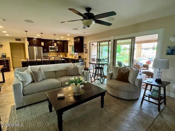 a living room with furniture and a large window