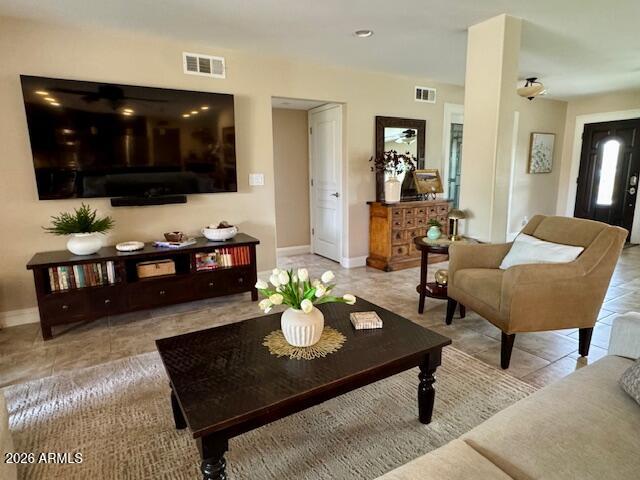 5610 East Justine Road Scottsdale, AZ 85254 - Photo 6 of 28 a living room with furniture and a flat screen tv