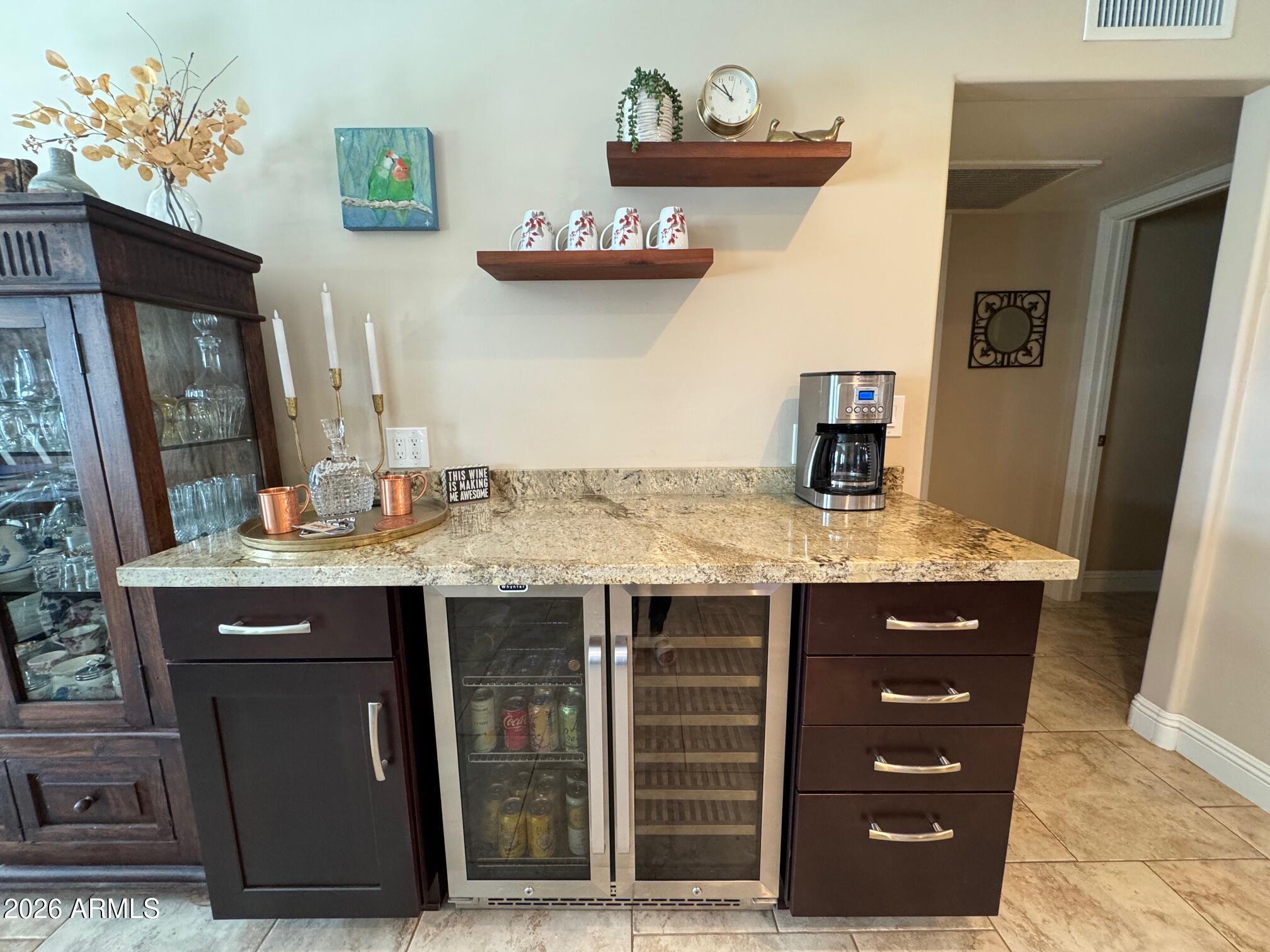 5610 East Justine Road Scottsdale, AZ 85254 - Photo 8 of 28 a bathroom with a granite countertop sink a mirror and vanity
