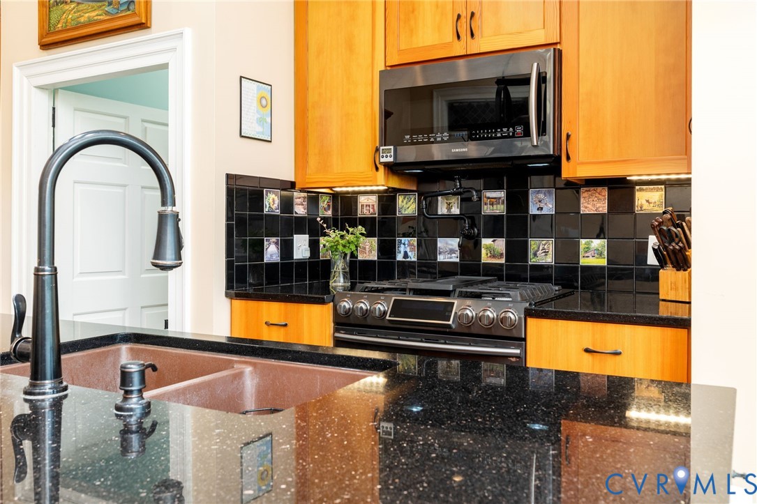 2284 Wallace's Bridge Road Lunenburg, VA 23952 - Photo 16 of 89 Black speckled countertops, double basin sink, bla