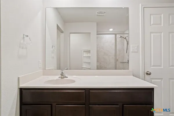 a bathroom with a sink and a mirror