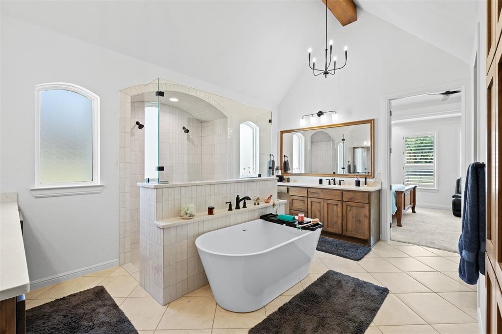2012 Southern Rise Court Granbury, TX 76049 - Photo 16 of 40 a bathroom with a tub sink shower and mirror
