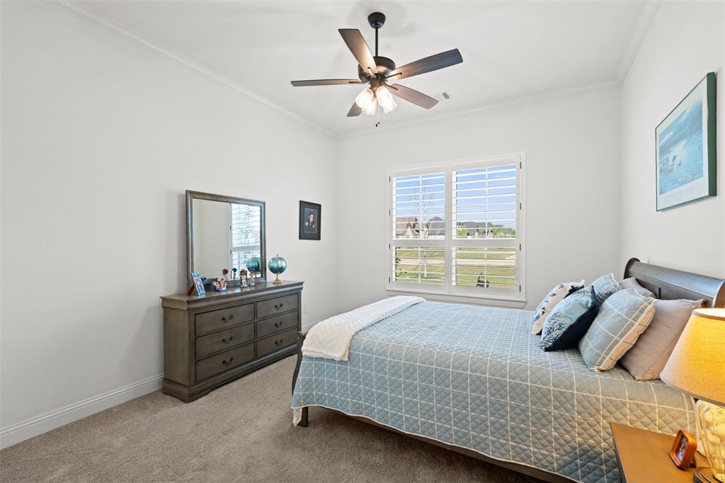 2012 Southern Rise Court Granbury, TX 76049 - Photo 17 of 40 a bedroom with a bed and window
