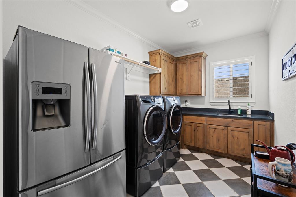 2012 Southern Rise Court Granbury, TX 76049 - Photo 25 of 40 a kitchen with stainless steel appliances granite countertop a refrigerator and a sink