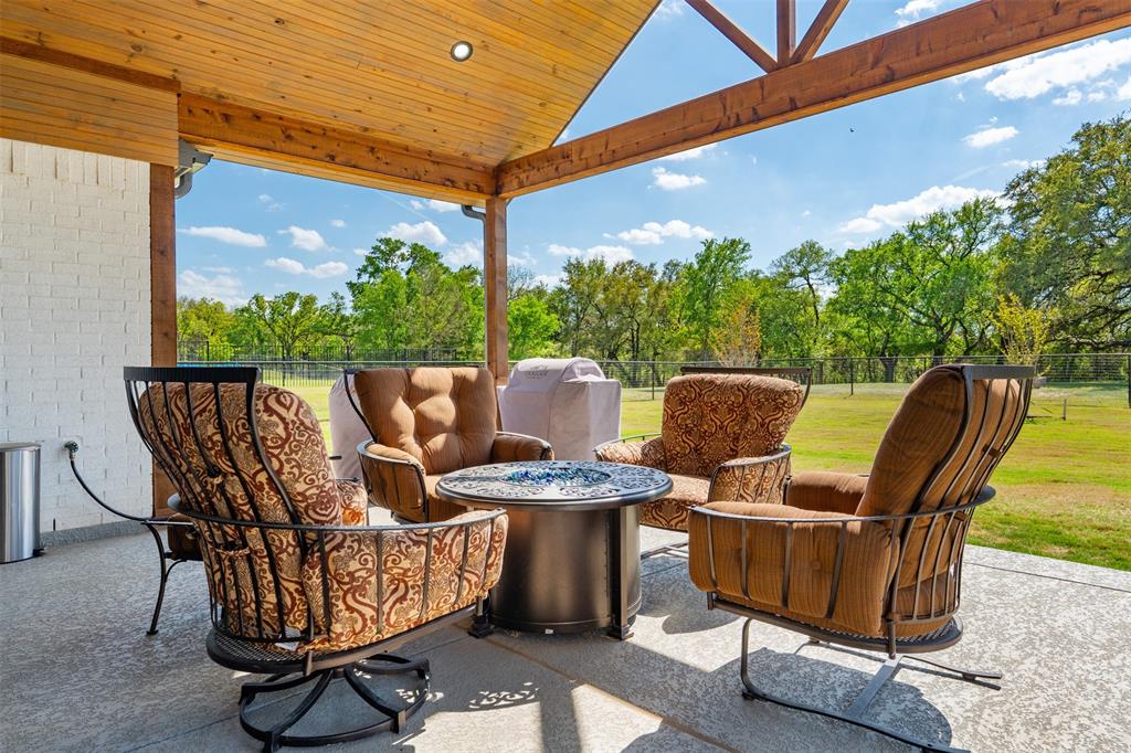 2012 Southern Rise Court Granbury, TX 76049 - Photo 27 of 40 a view of a patio with table and chairs and potted plants