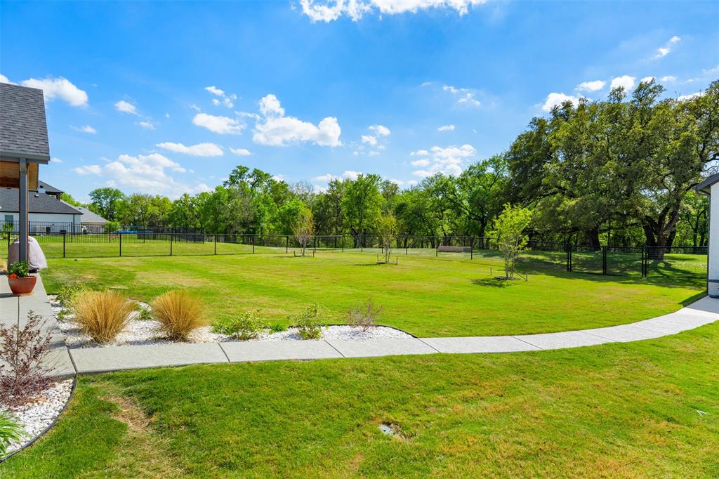 2012 Southern Rise Court Granbury, TX 76049 - Photo 31 of 40 a view of a golf course with a garden