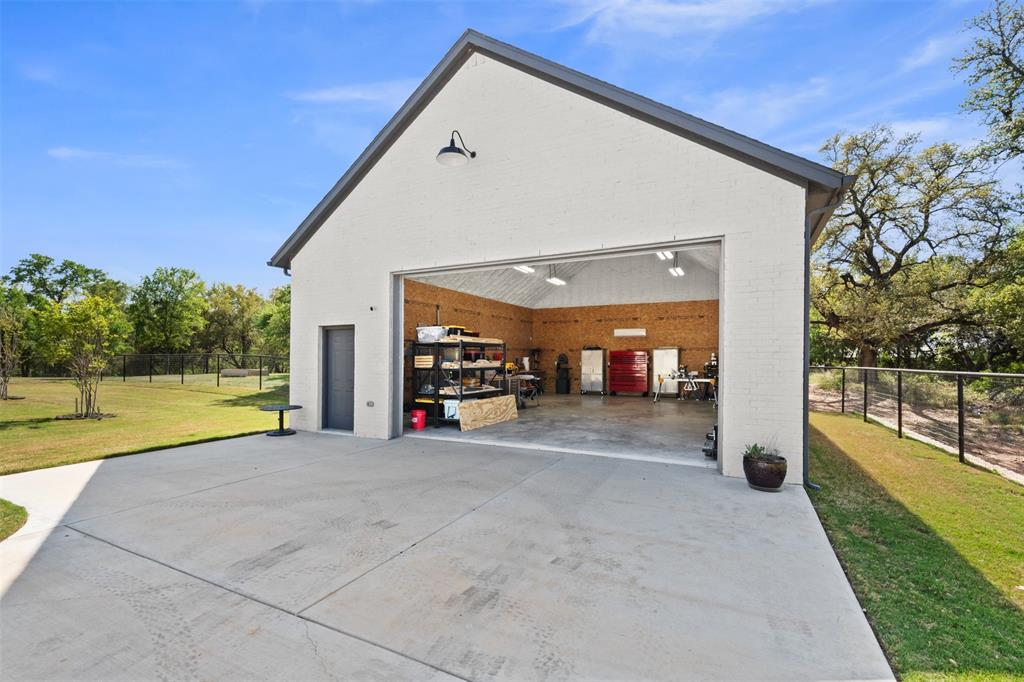 2012 Southern Rise Court Granbury, TX 76049 - Photo 33 of 40 a view of a house with swimming pool and sitting area