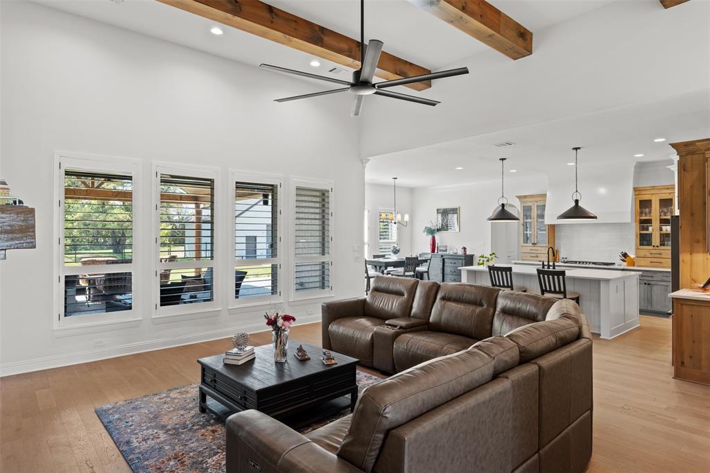 2012 Southern Rise Court Granbury, TX 76049 - Photo 7 of 40 a living room with furniture and a large window