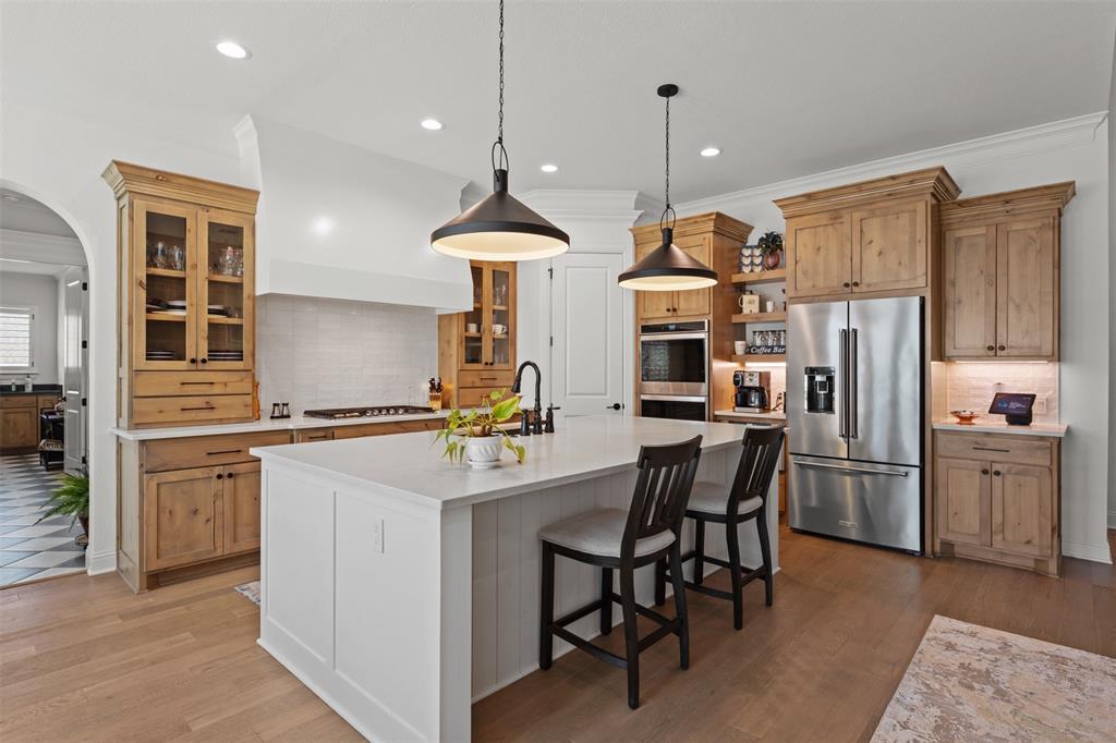 2012 Southern Rise Court Granbury, TX 76049 - Photo 9 of 40 a kitchen with refrigerator cabinets and a table