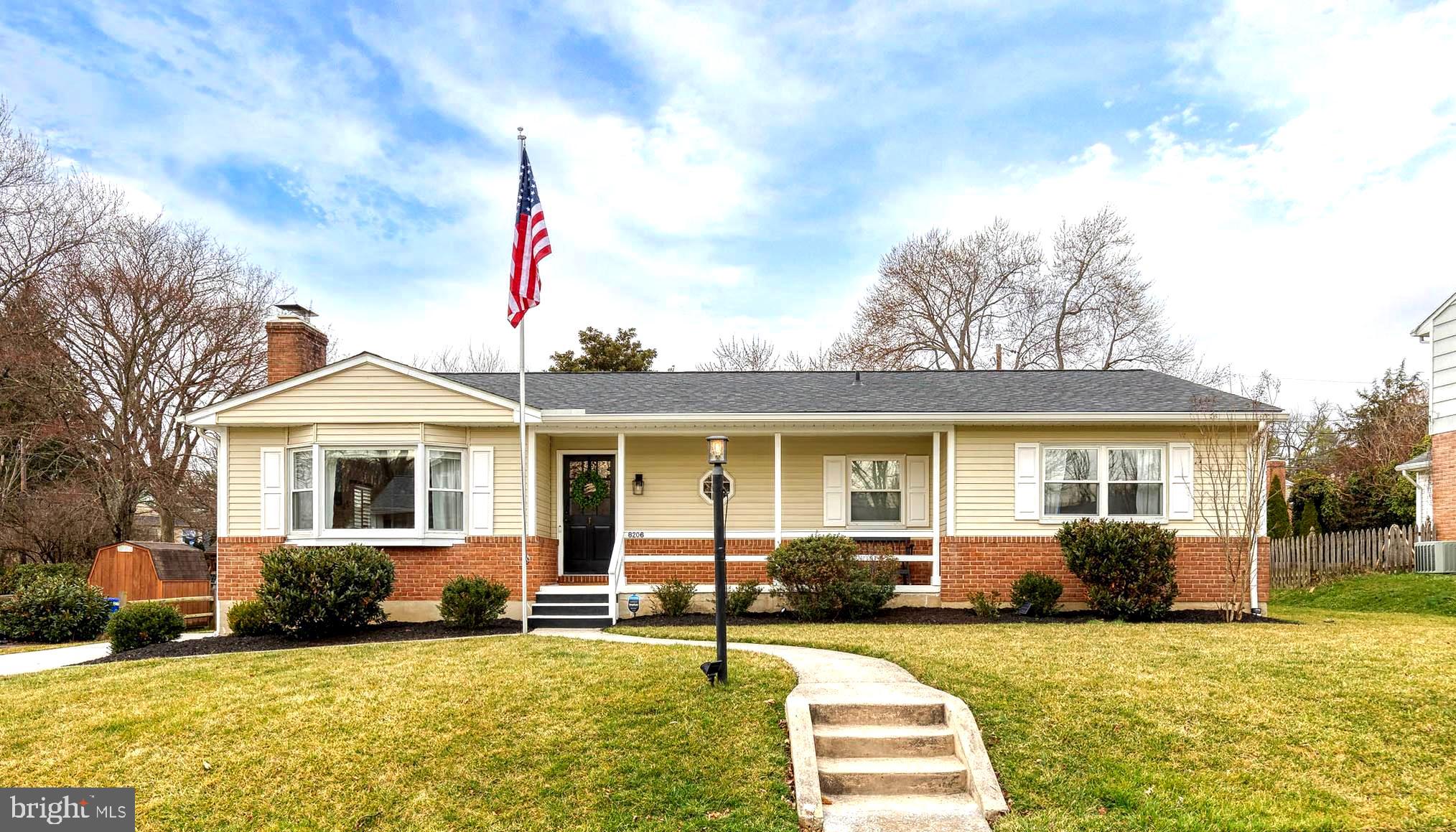 8206 Burnley Road Towson, MD 21204 - Photo 1 of 37 a front view of a house with a yard