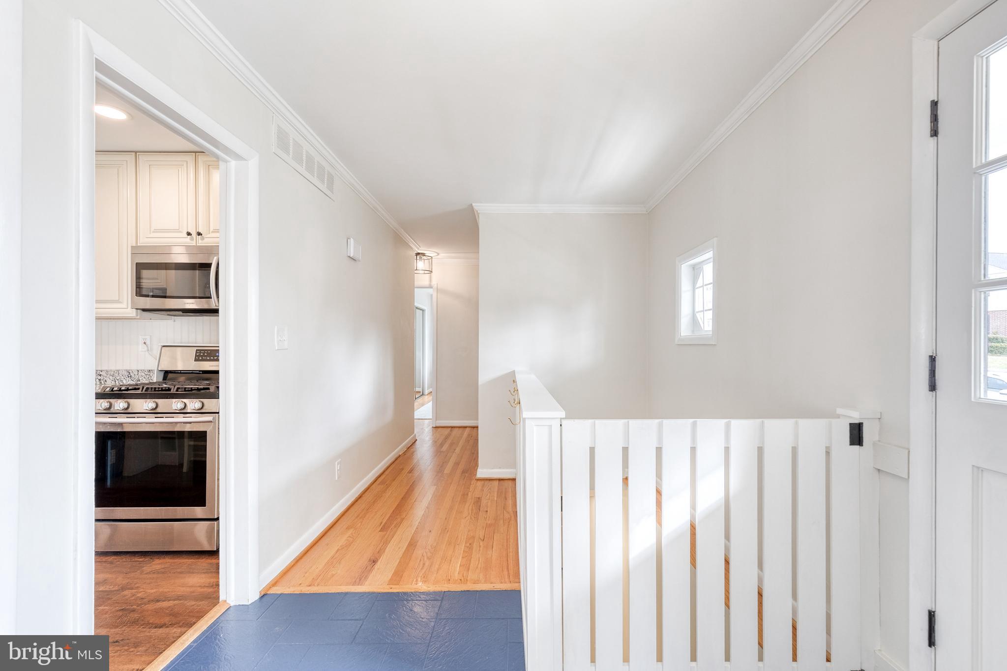 8206 Burnley Road Towson, MD 21204 - Photo 13 of 37 a view of a kitchen with wooden floor and a kitchen