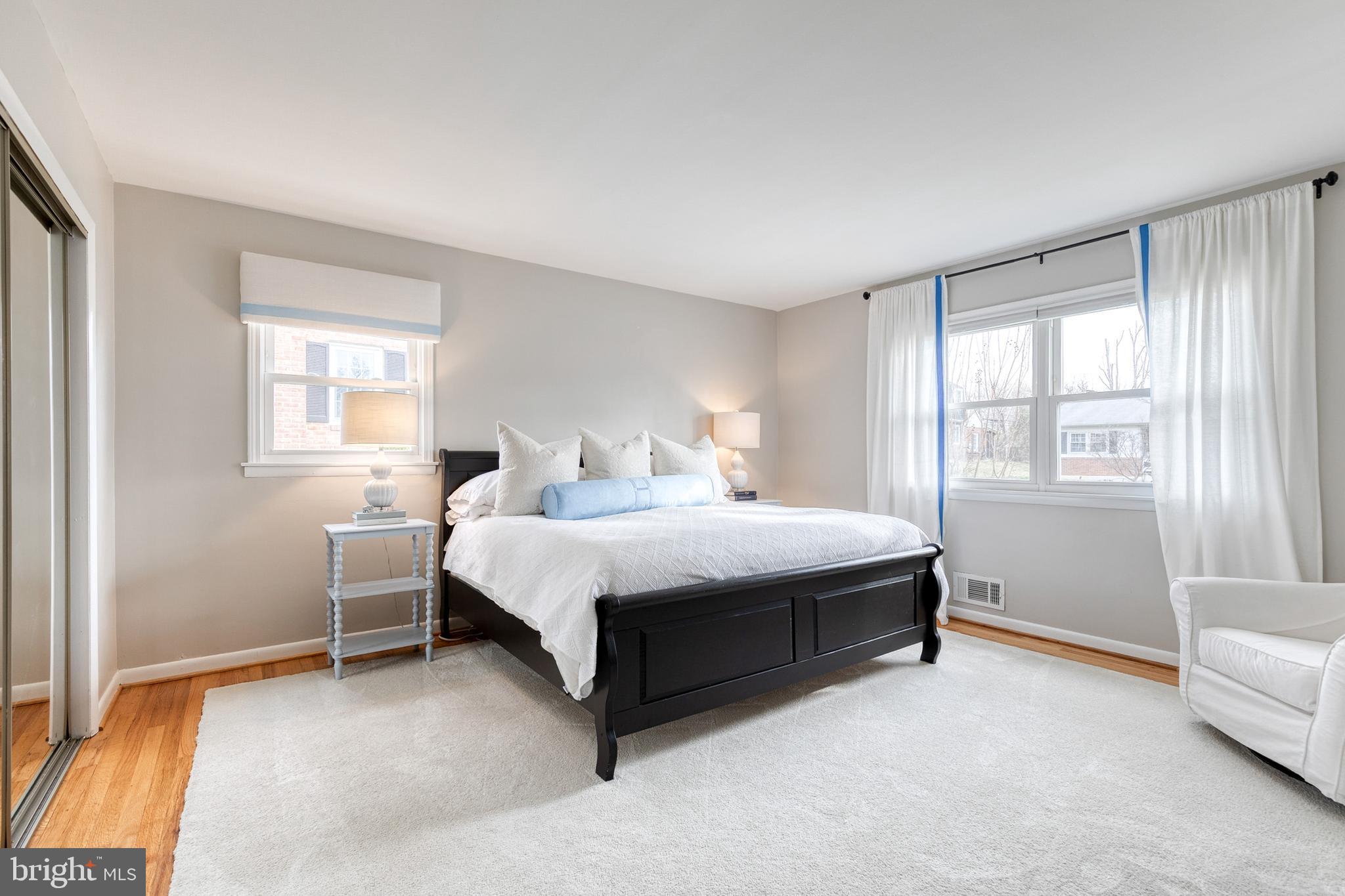 8206 Burnley Road Towson, MD 21204 - Photo 15 of 37 a bed sitting in a bedroom next to a window