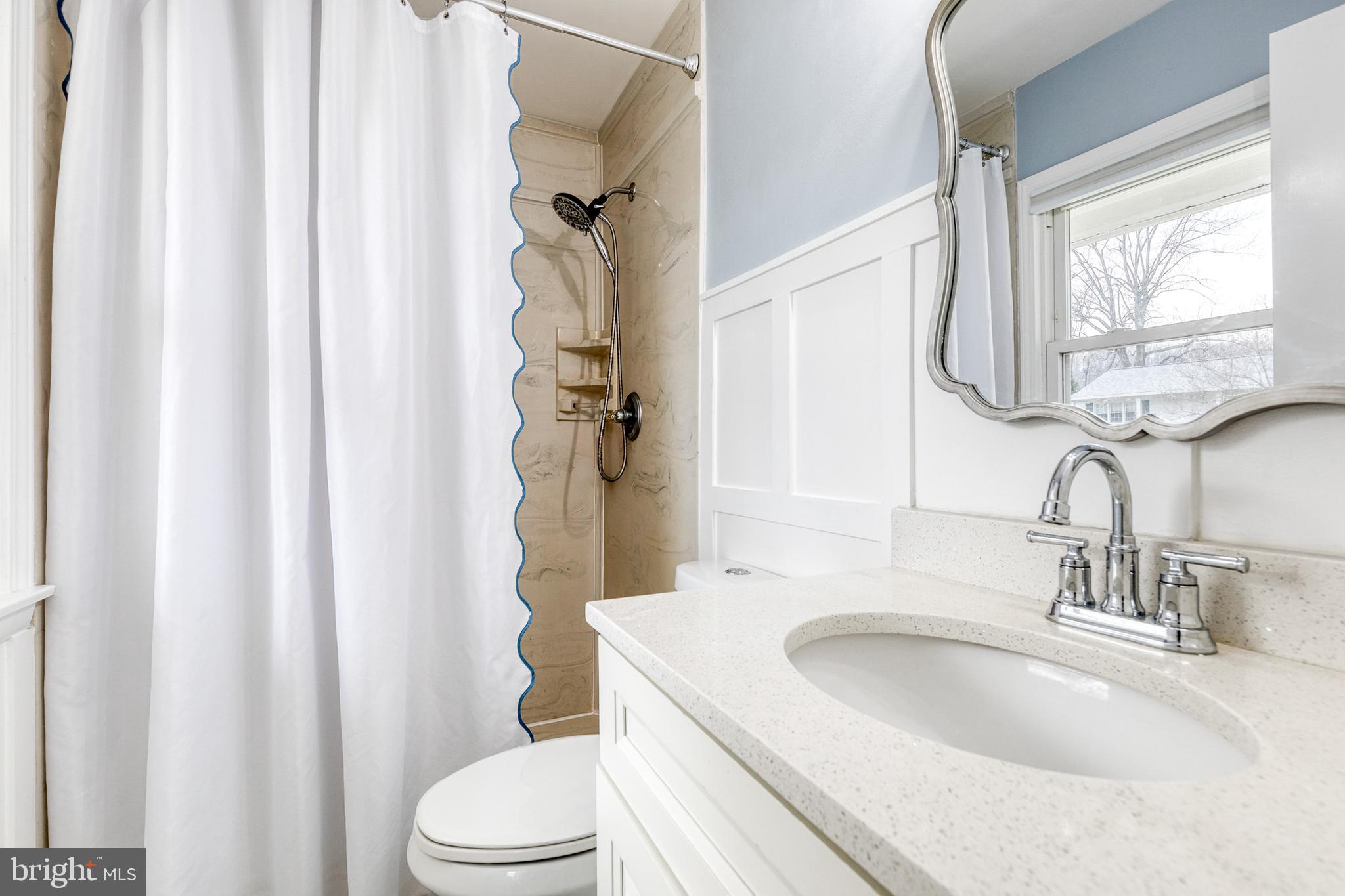 8206 Burnley Road Towson, MD 21204 - Photo 17 of 37 a bathroom with a sink toilet and shower