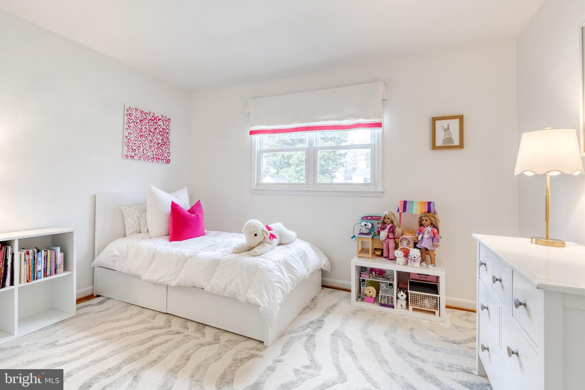 8206 Burnley Road Towson, MD 21204 - Photo 18 of 37 a bedroom with a bed and a bookshelf