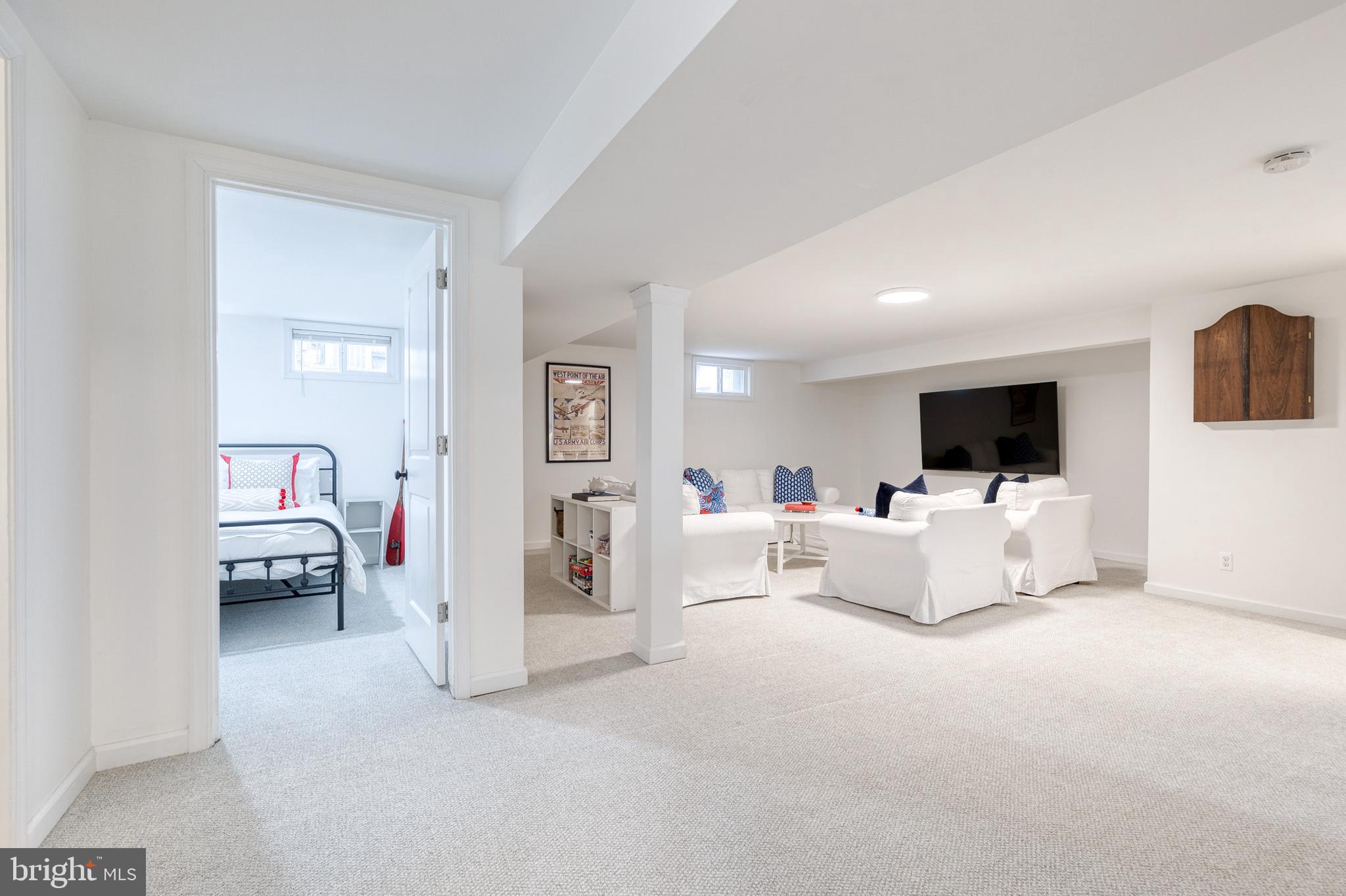 8206 Burnley Road Towson, MD 21204 - Photo 23 of 37 a living room with furniture and a flat screen tv